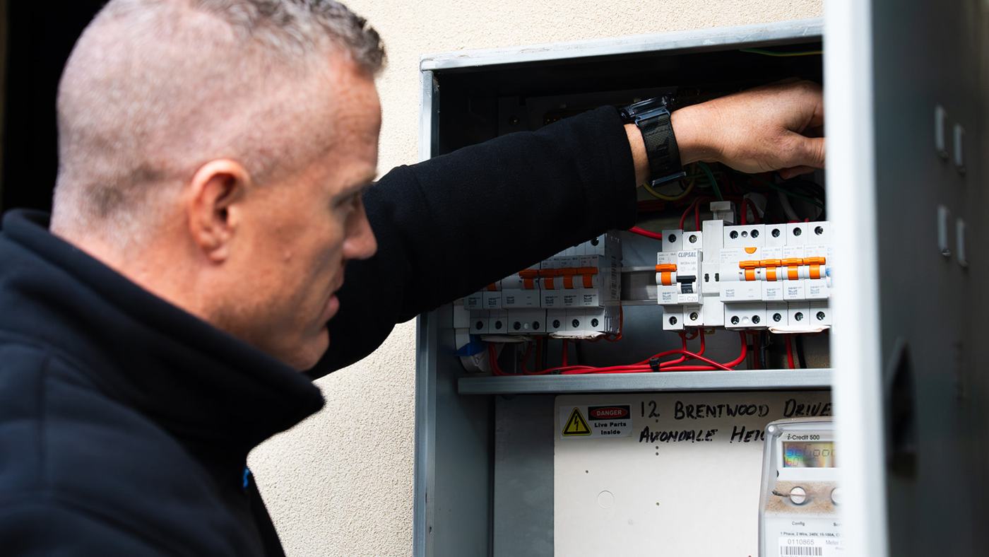 Lance from JAT Electrics working inside a switchboard