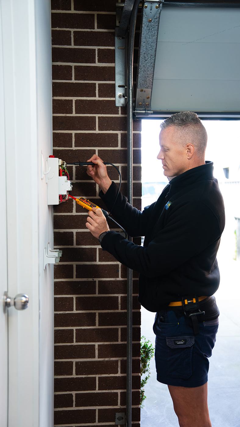 Electrician checking an outdoor electrical box
