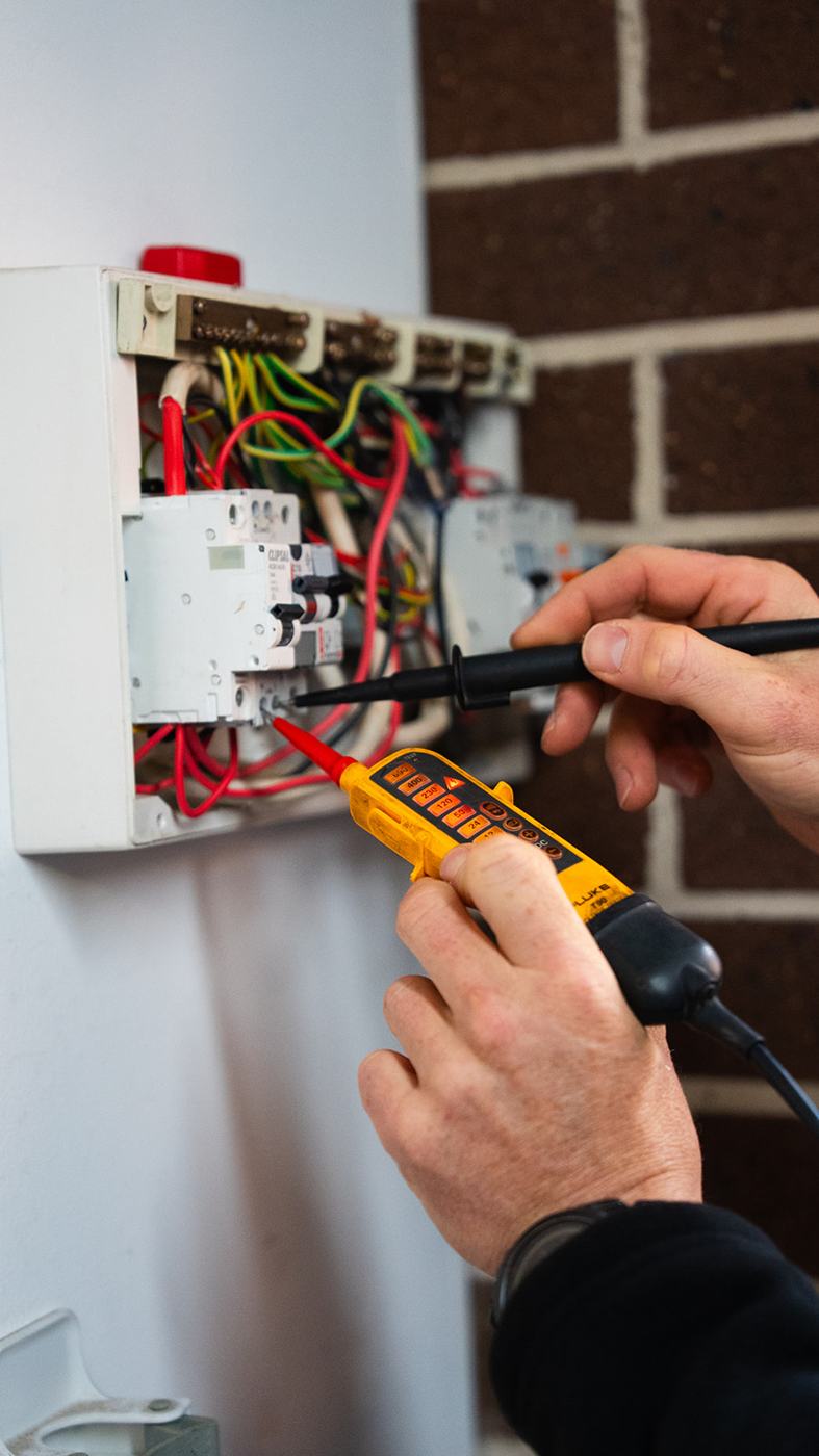 Voltage tester checking a switchboard