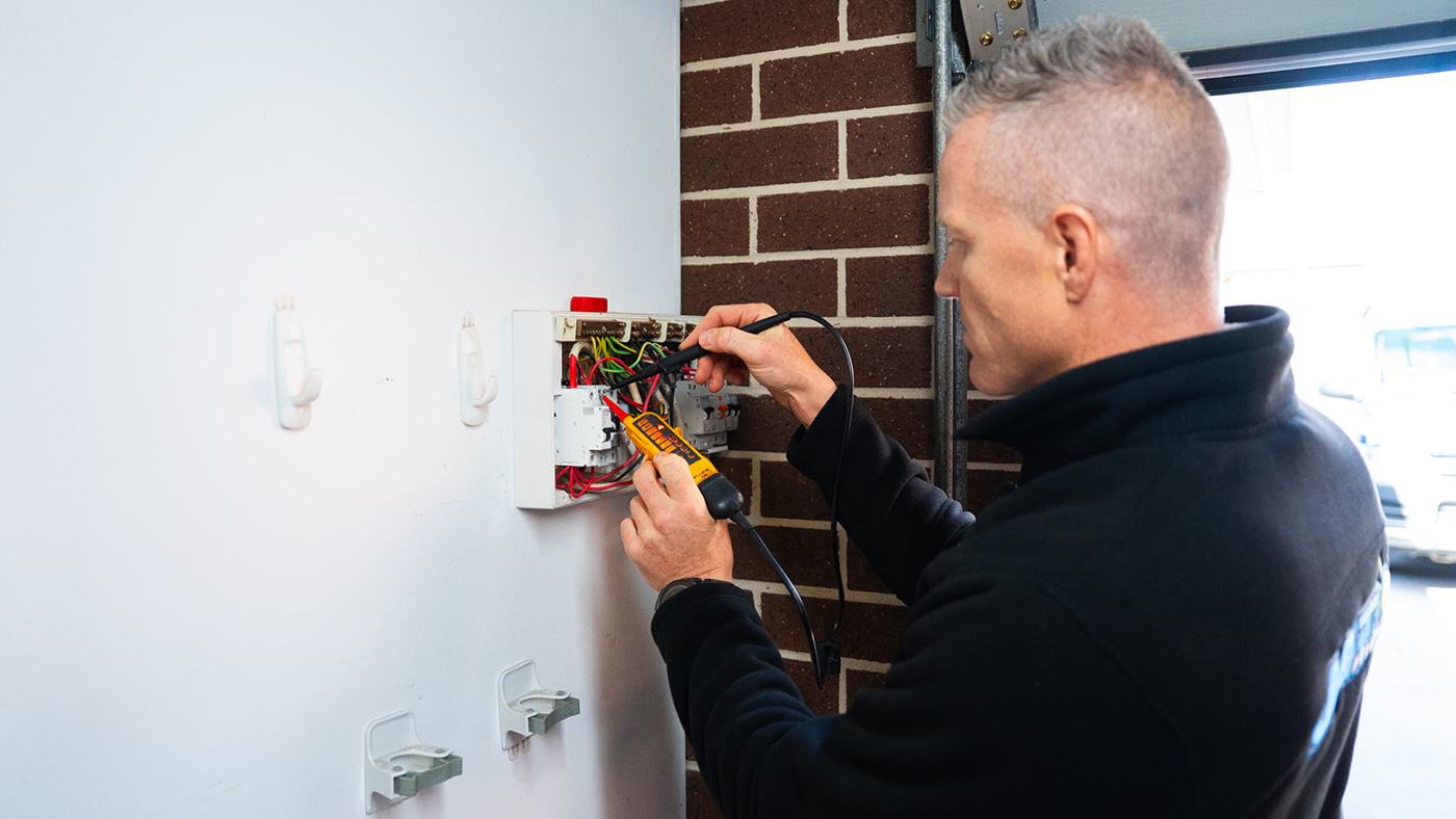 Electrician working on an external meter box