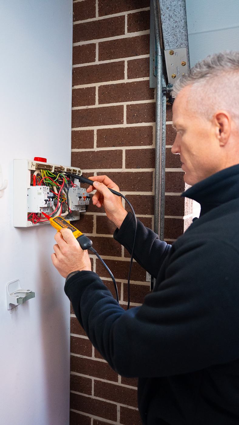 Electrician working at an external switchboard
