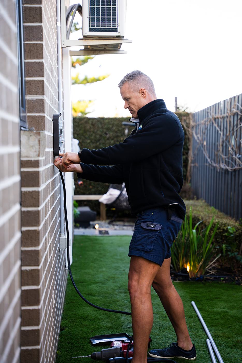 Electrician connecting an EV charger
